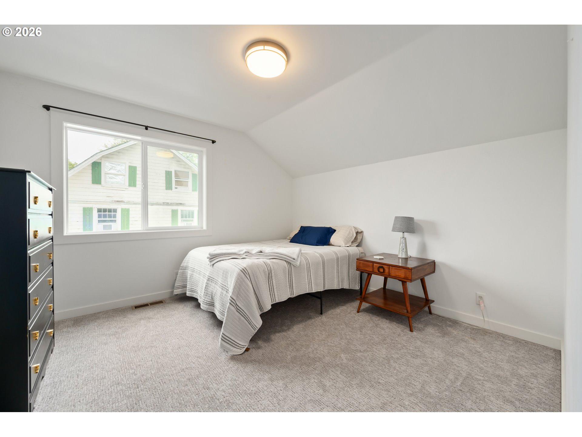 2845 Harlow Road Eugene, OR 97401 - Photo 27 of 43 a bed room with a bed and a window