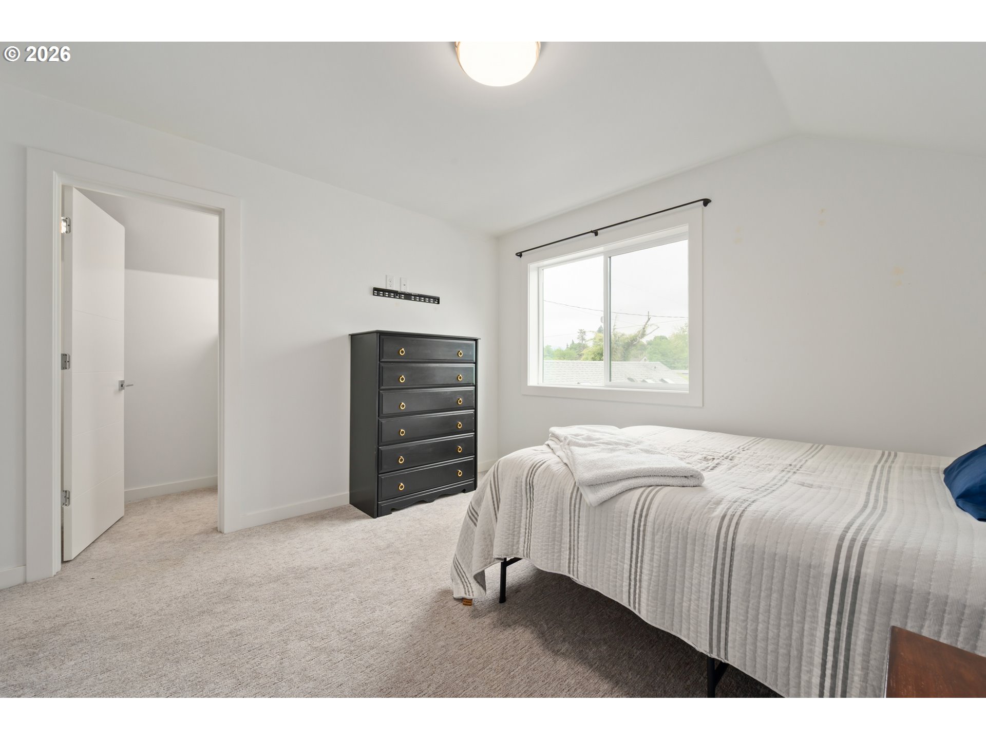 2845 Harlow Road Eugene, OR 97401 - Photo 28 of 43 a bedroom with a bed and dresser