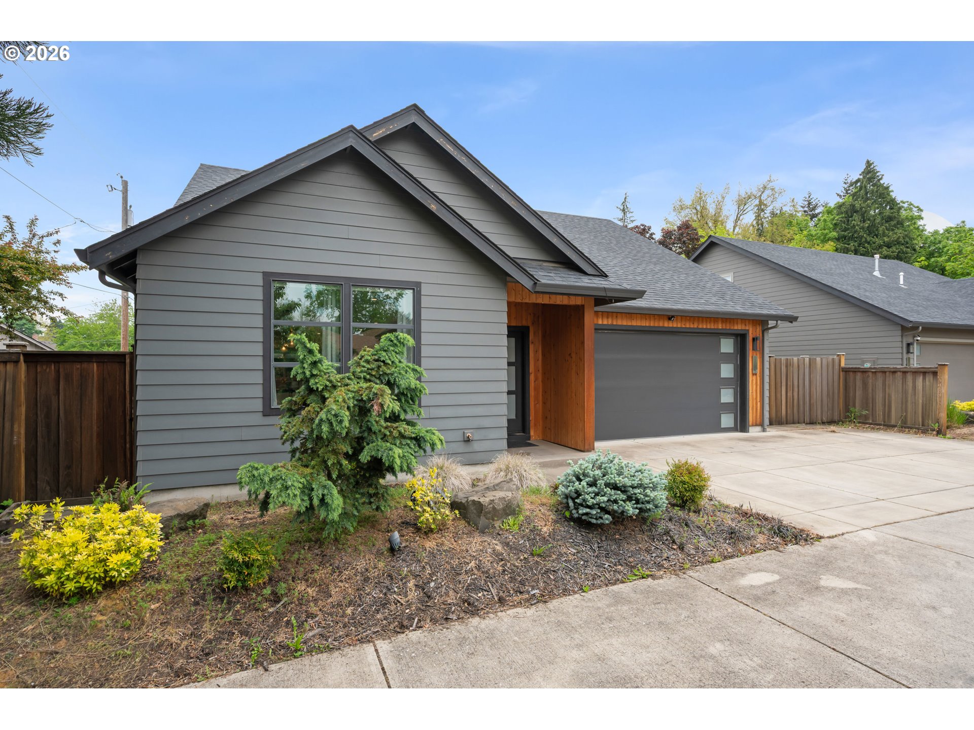 2845 Harlow Road Eugene, OR 97401 - Photo 3 of 43 a front view of a house with a yard