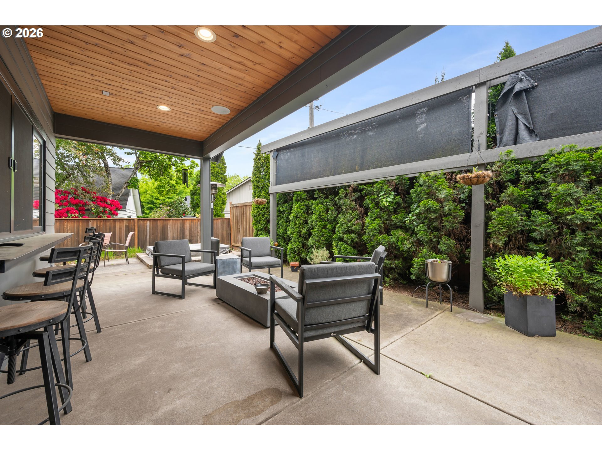 2845 Harlow Road Eugene, OR 97401 - Photo 34 of 43 a patio with table and chairs and potted plants