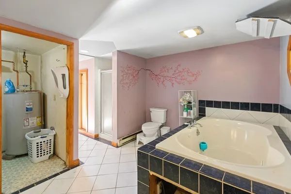 a bathroom with a tub sink and a shower