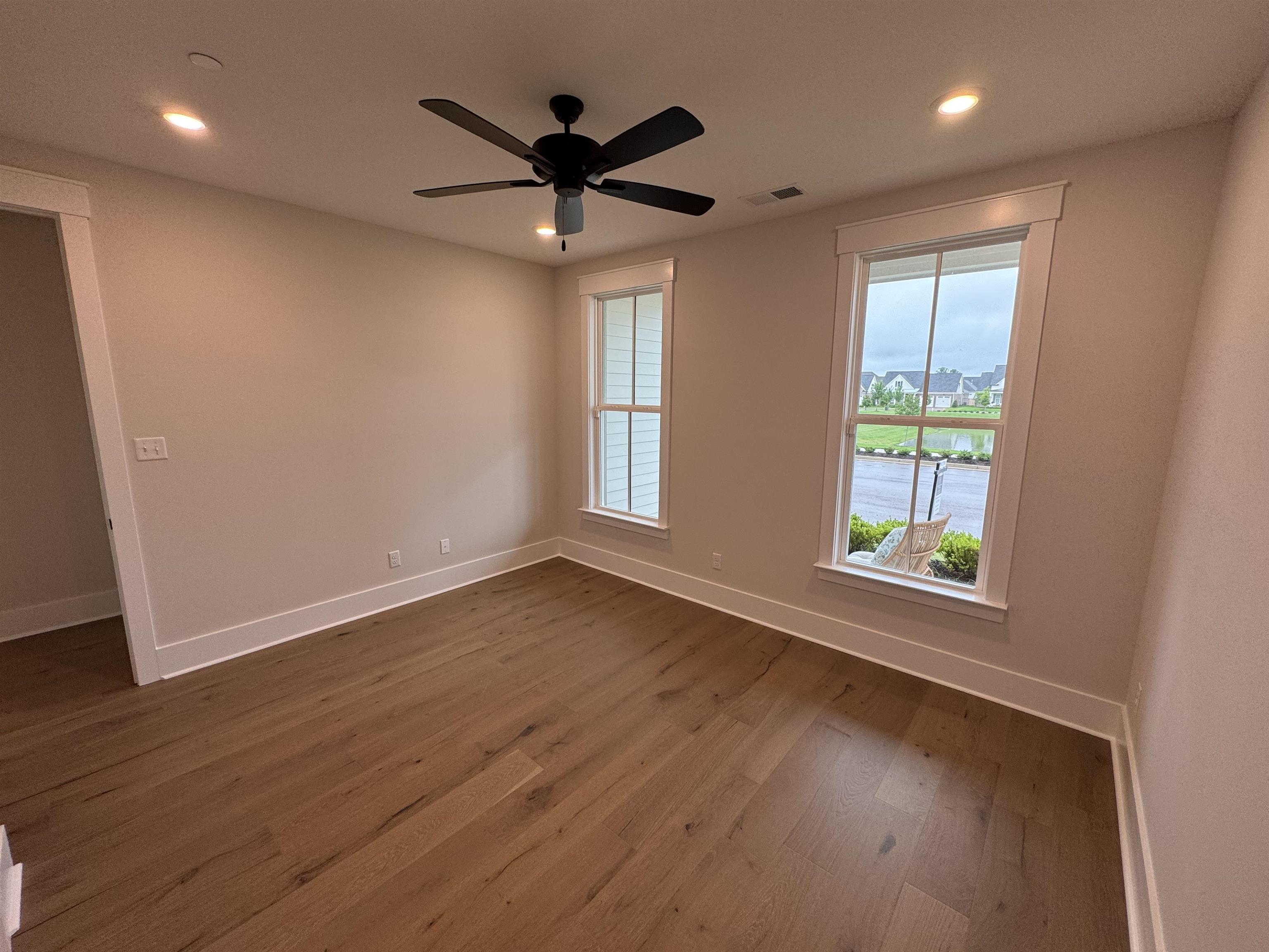 20 Rambling Rex Trail Piperton, TN 38017 - Photo 27 of 31 a view of an empty room with wooden floor and a window