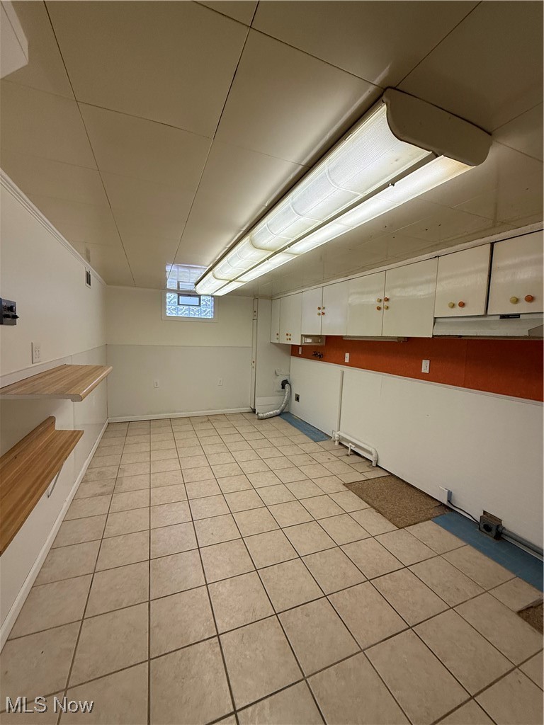 522 North 3rd Street Toronto, OH 43964 - Photo 39 of 47 Below grade area with light tile patterned flooring