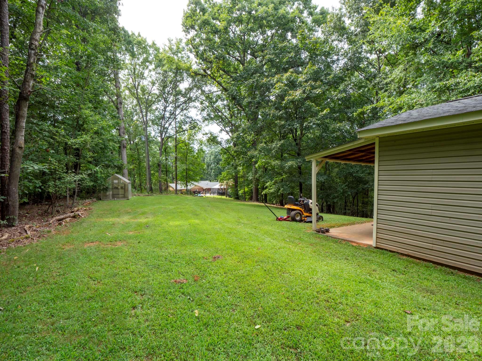 8720 Unionville-Brief Road Monroe, NC 28110 - Photo 10 of 35 a view of a backyard with a sitting area