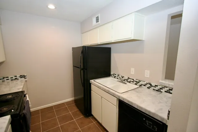 a utility room with washer and dryer