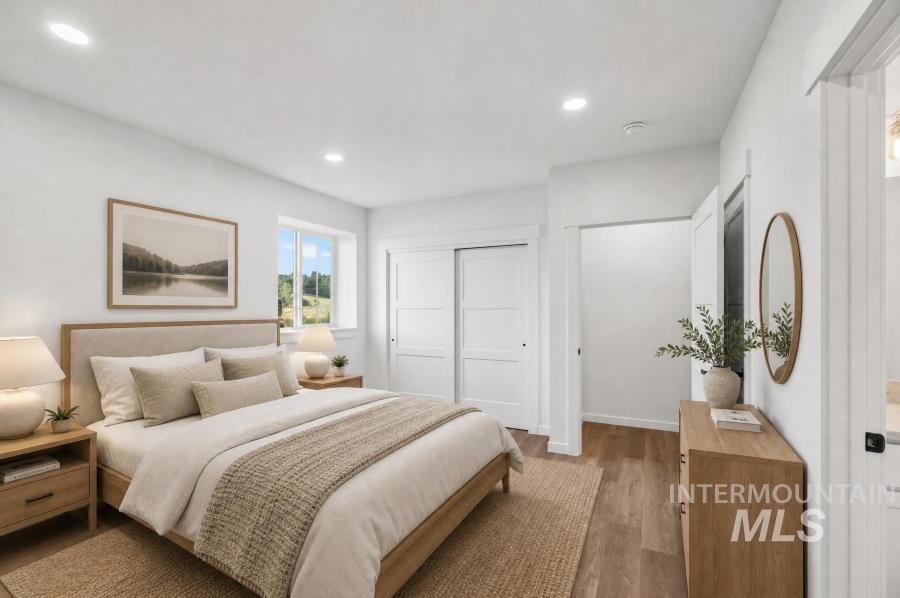 1298 Edington Moscow, ID 83843 - Photo 22 of 32 Recessed lighting, wood-finish flooring, and white paneled closet doors