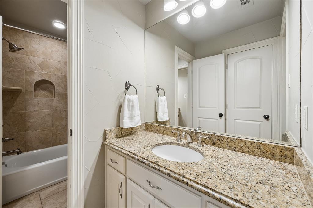 1608 Tuscan Ridge Circle Southlake, TX 76092 - Photo 25 of 36 a bathroom with a granite countertop sink and a mirror