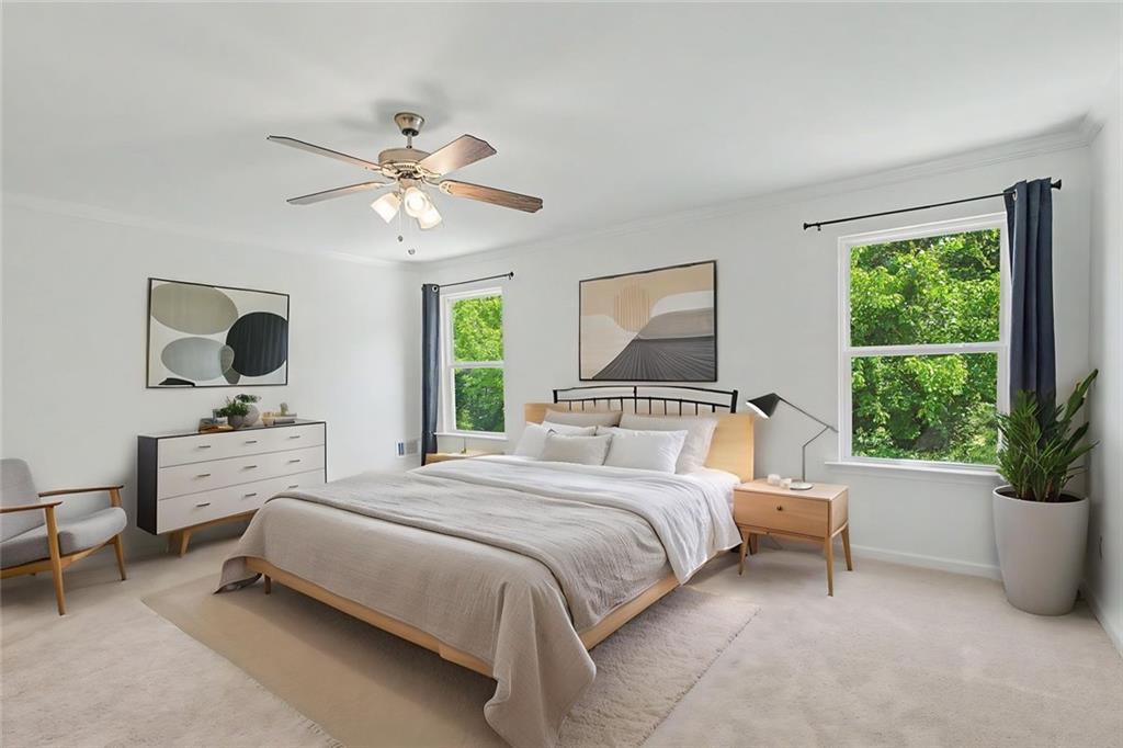 2310 Portrush Way Southeast Atlanta, GA 30339 - Photo 26 of 38 a bedroom with a large bed and a flat screen tv