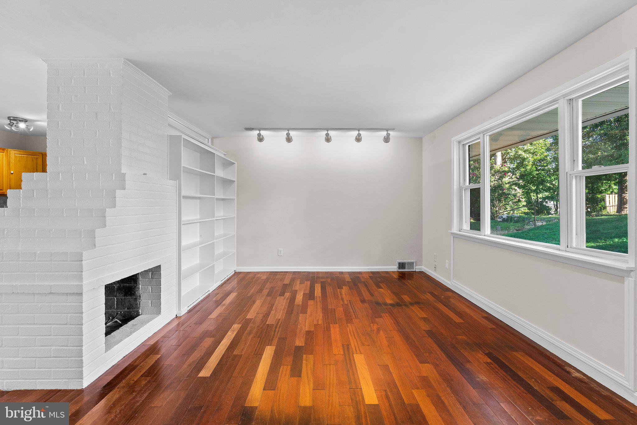 5930 Atteentee Road Springfield, VA 22150 - Photo 13 of 30 a view of empty room with wooden floor and fan