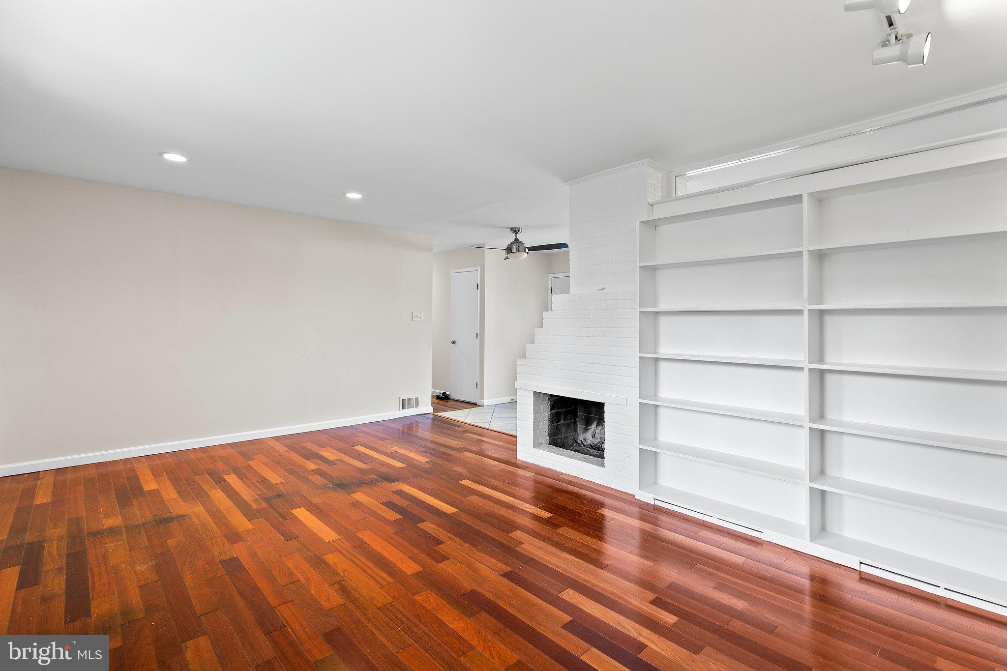 5930 Atteentee Road Springfield, VA 22150 - Photo 16 of 30 a view of empty room with wooden floor and fan