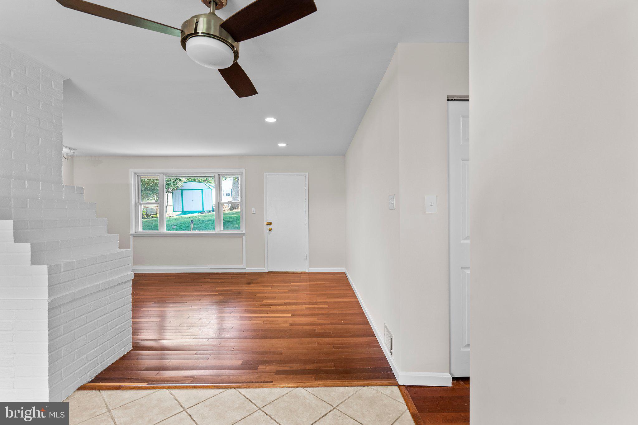 5930 Atteentee Road Springfield, VA 22150 - Photo 17 of 30 an empty room with windows and ceiling fan