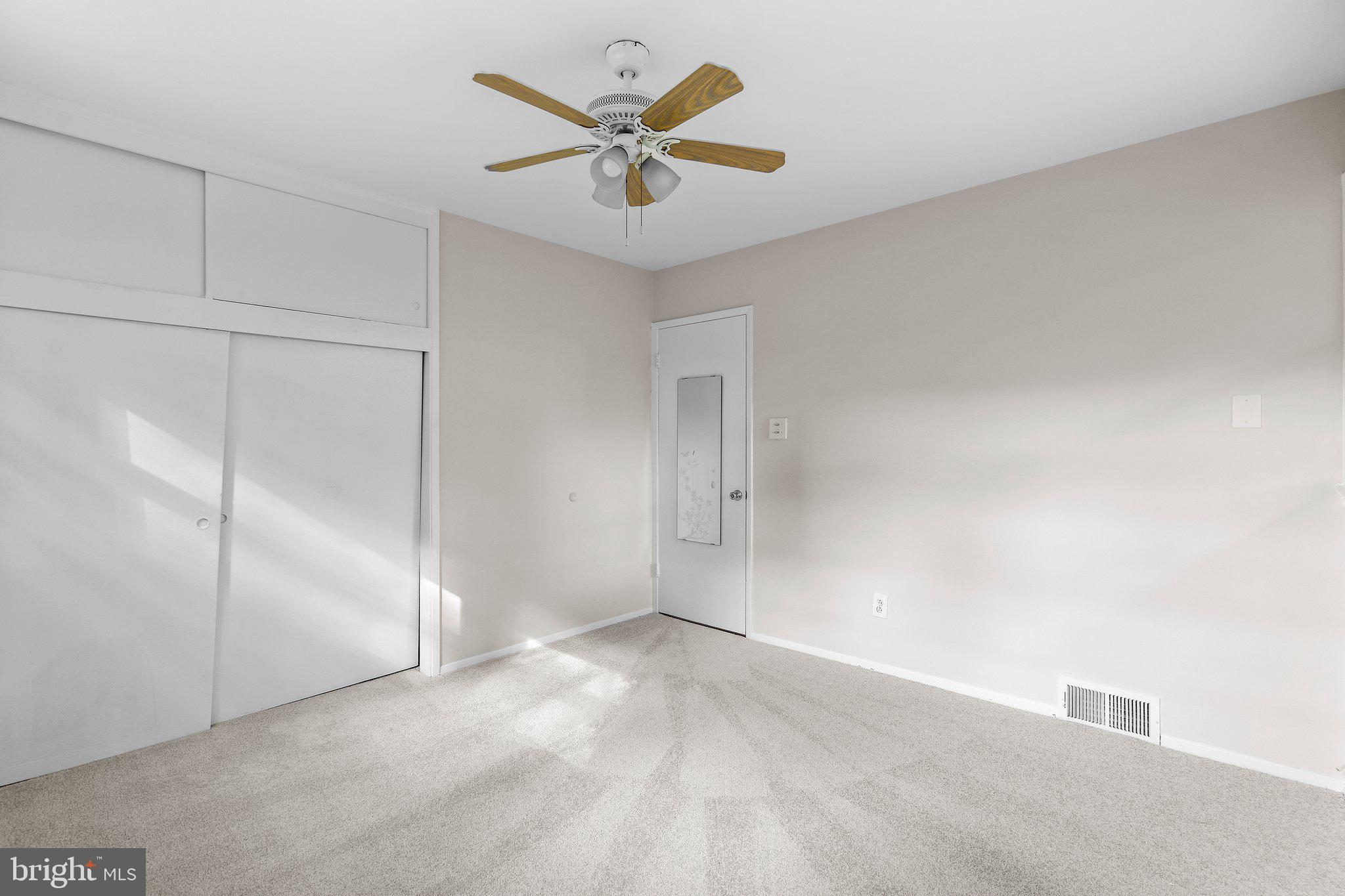 5930 Atteentee Road Springfield, VA 22150 - Photo 23 of 30 an empty room with closet and fan