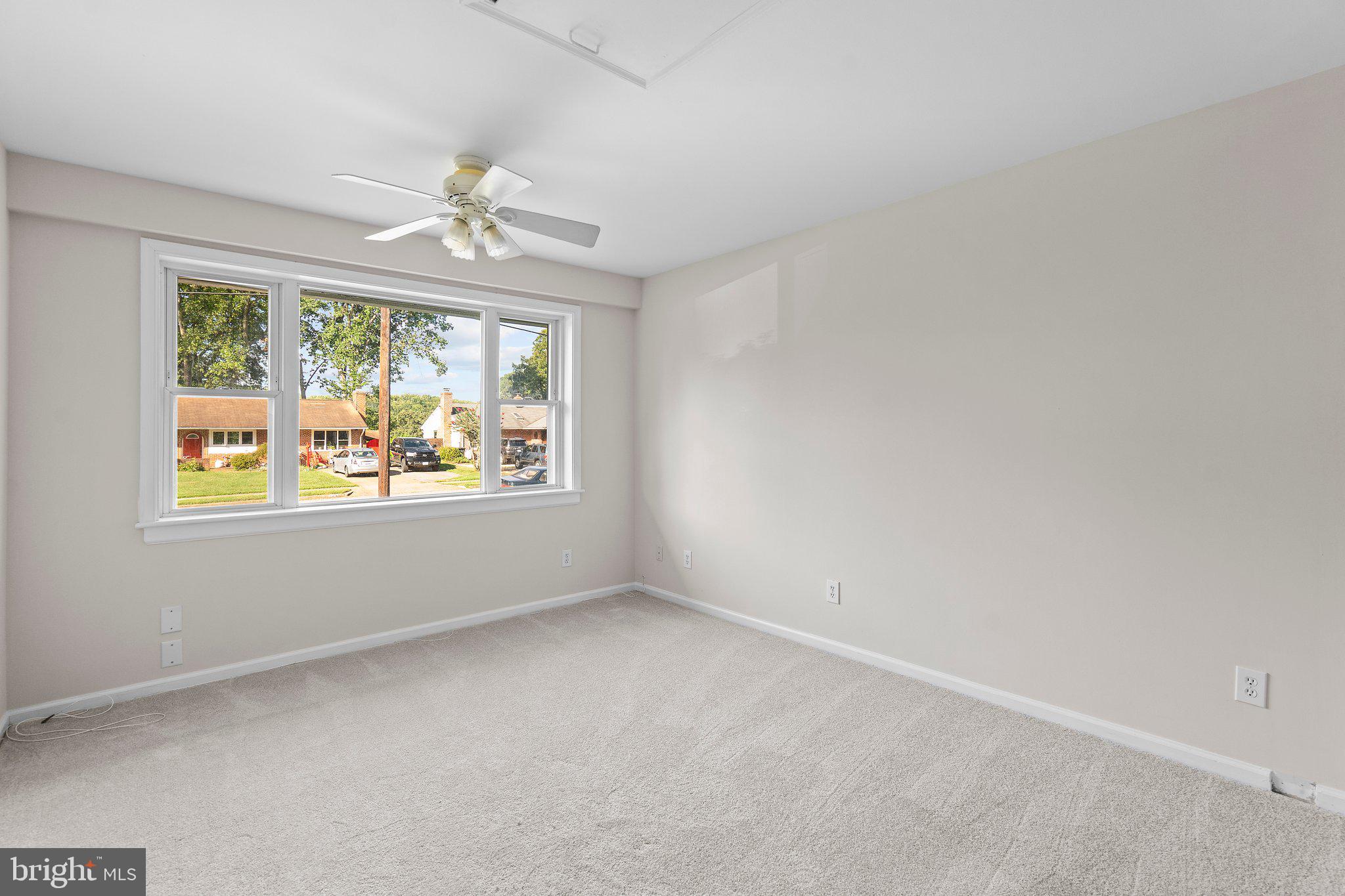 5930 Atteentee Road Springfield, VA 22150 - Photo 27 of 30 an empty room with windows and ceiling fan