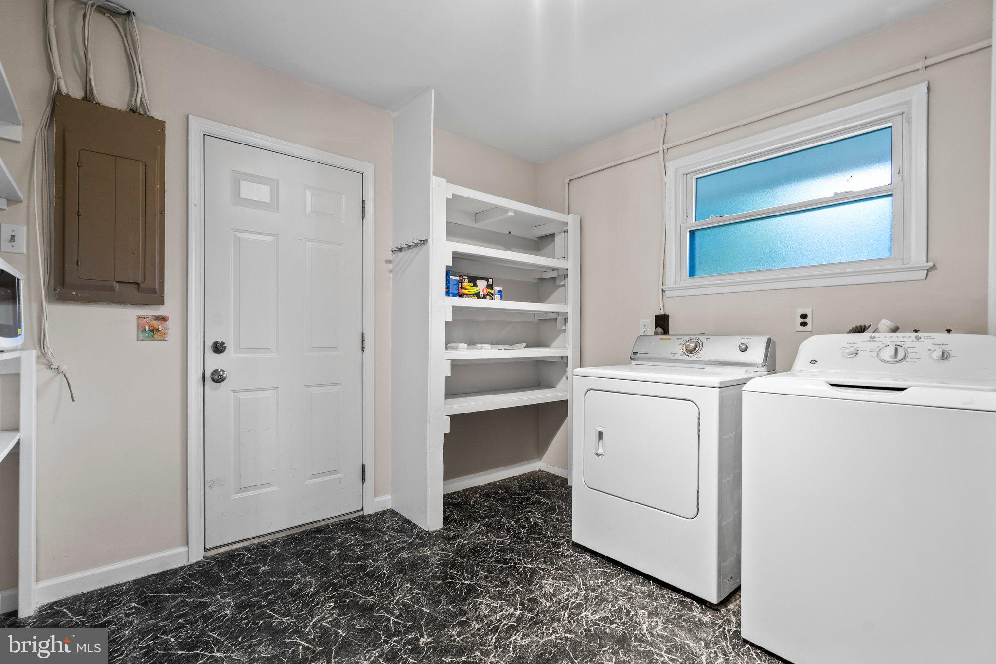 5930 Atteentee Road Springfield, VA 22150 - Photo 28 of 30 a storage room with a washer and dryer