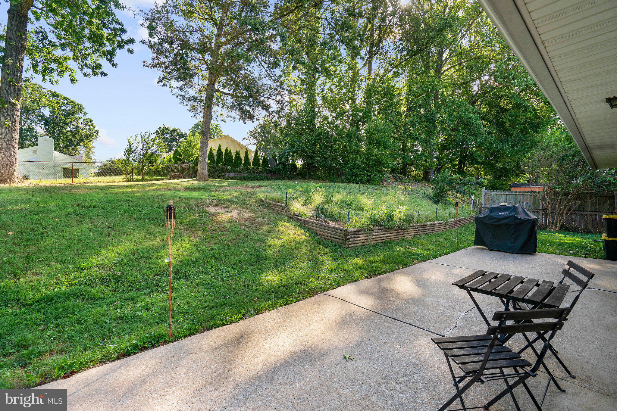 5930 Atteentee Road Springfield, VA 22150 - Photo 6 of 30 a view of a backyard with sitting area