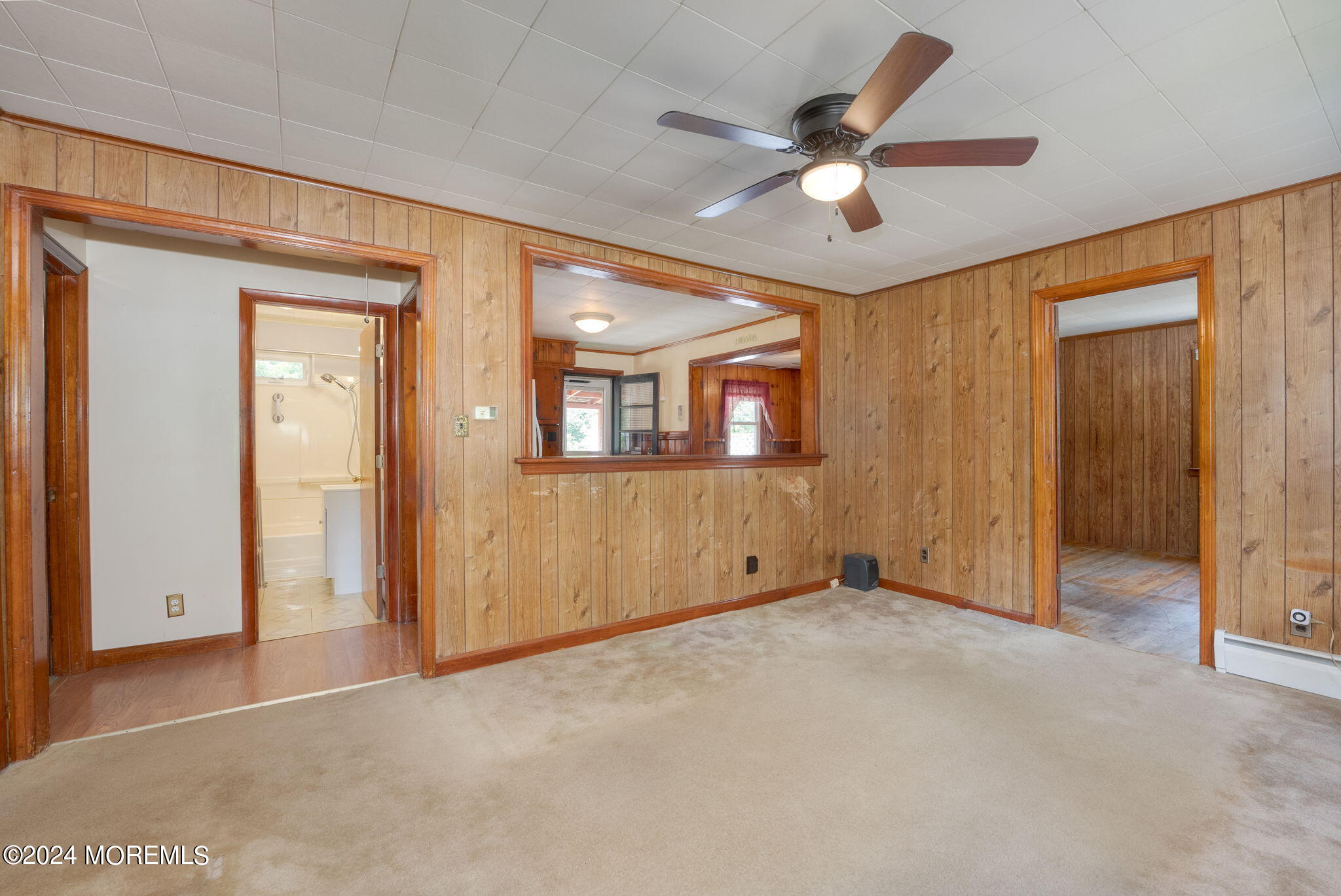 74 Pinewood Road Howell, NJ 07731 - Photo 3 of 24 an empty room with ceiling fan and window