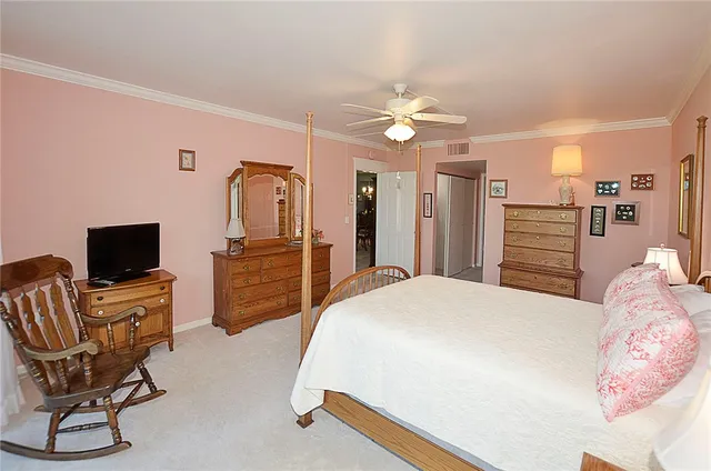 a bed room with a bed and a large window