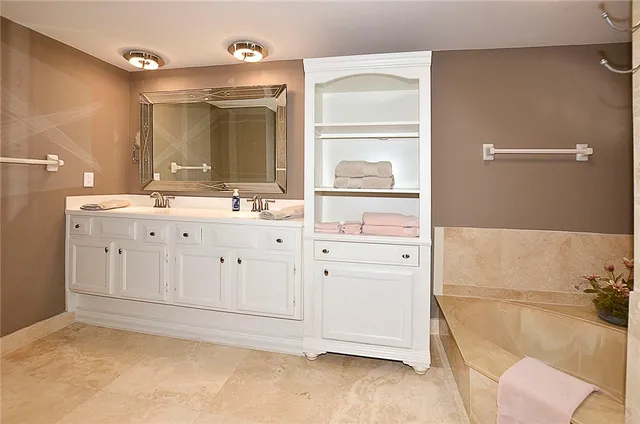 a bathroom with a toilet sink and shower