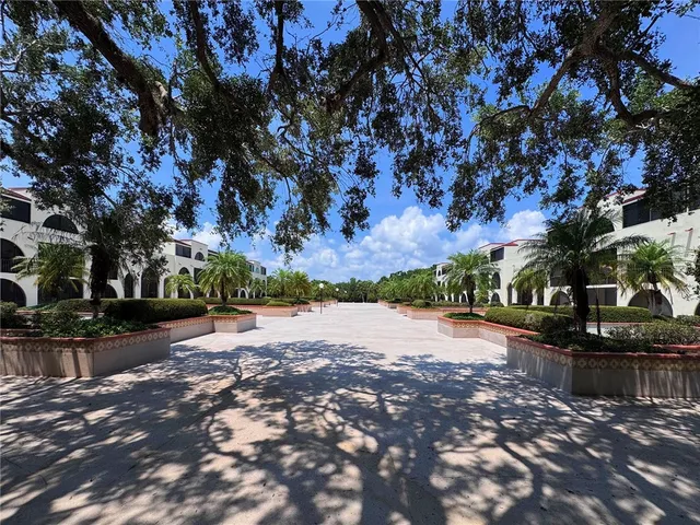 a living room with furniture a window and a flat screen tv