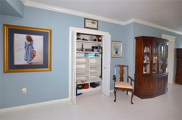 a bedroom with a bed and a dresser in it