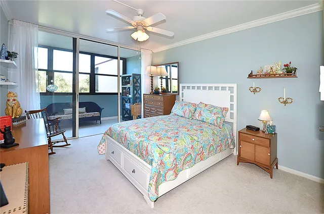a spacious bathroom with a toilet a sink and a mirror