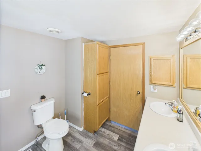 a bathroom with a sink and toilet