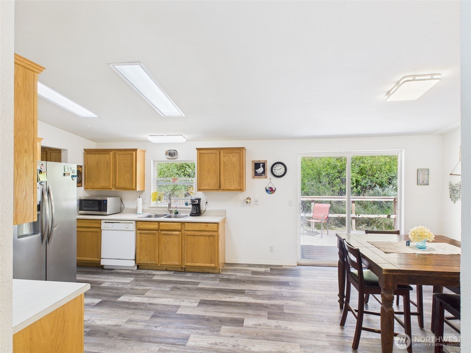 241 Wolf Fork Road Dayton, WA 99328 - Photo 16 of 40 a view of a dining room with furniture window and wooden floor