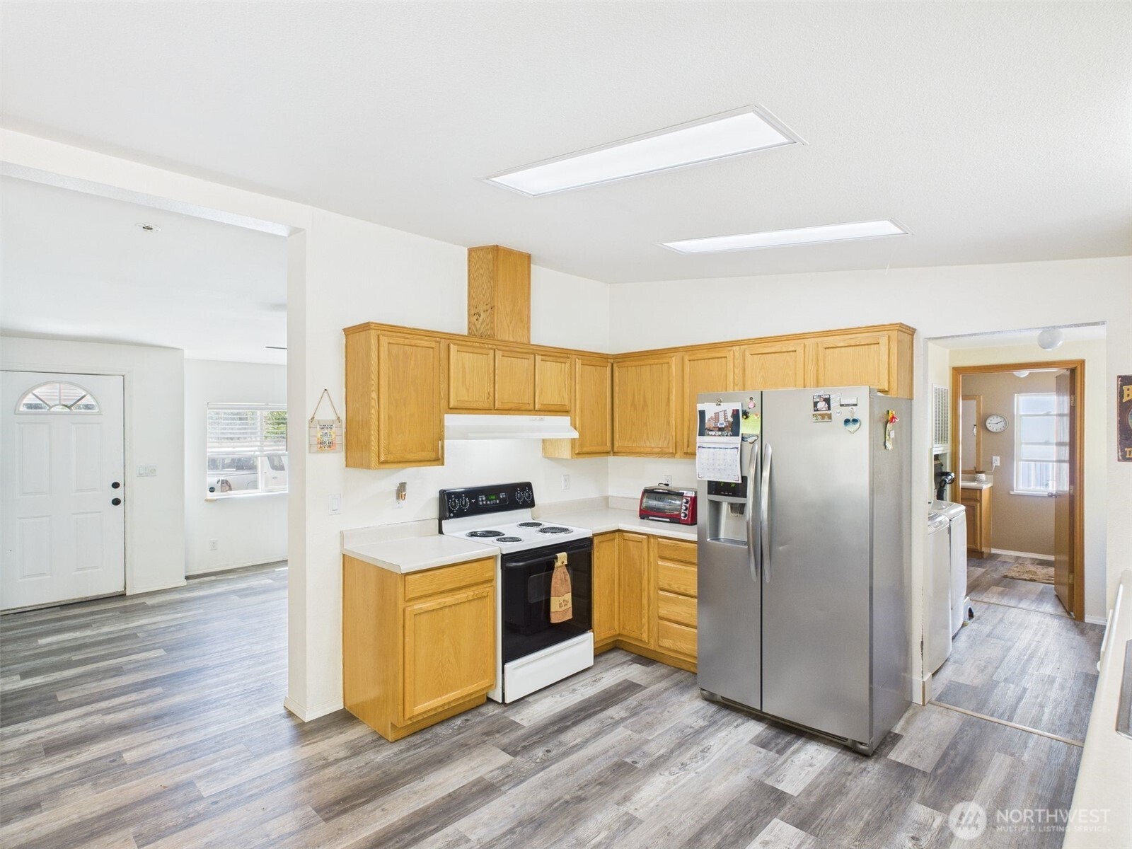 241 Wolf Fork Road Dayton, WA 99328 - Photo 21 of 40 a kitchen with stainless steel appliances granite countertop a refrigerator stove and sink
