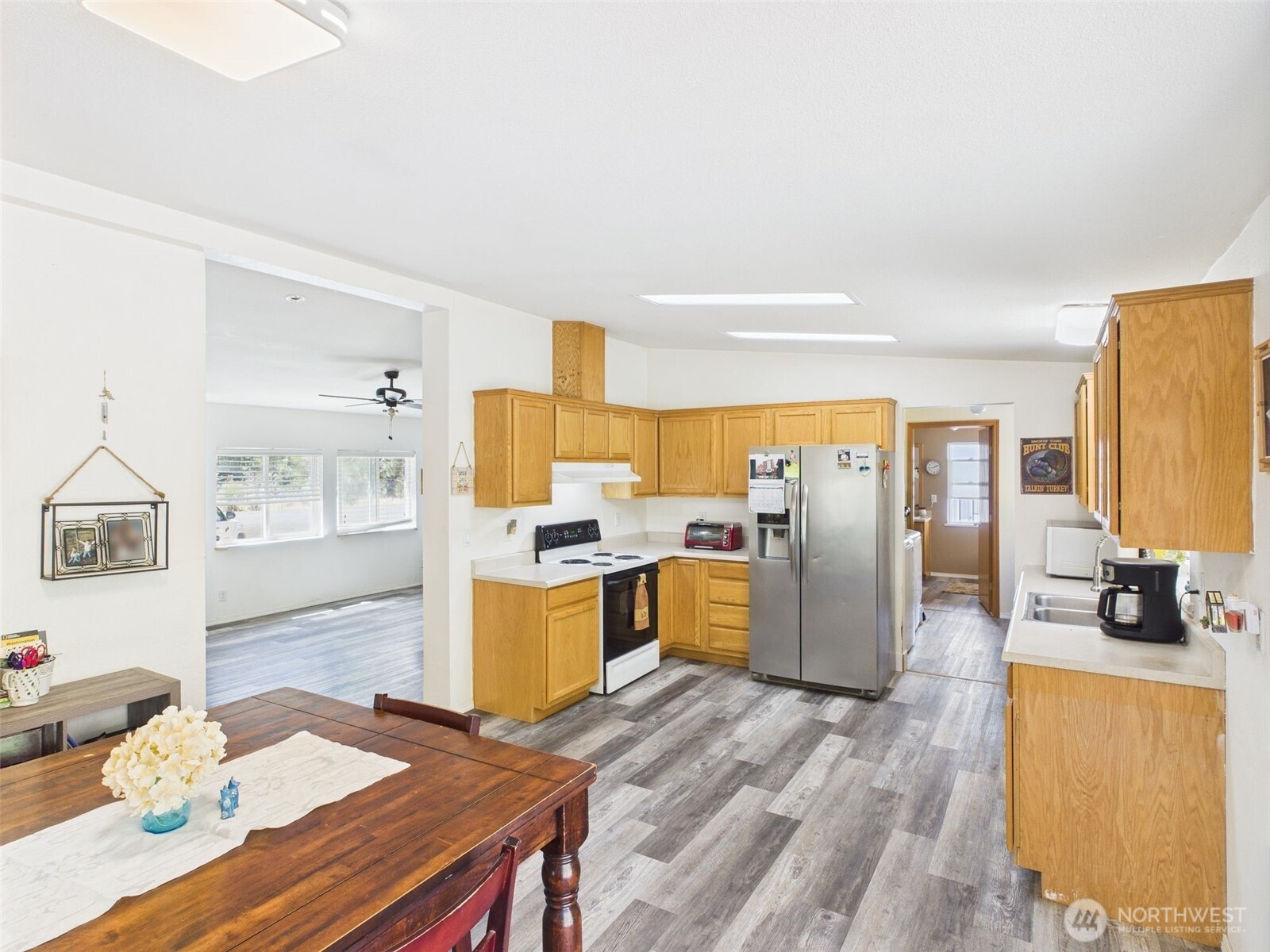 241 Wolf Fork Road Dayton, WA 99328 - Photo 3 of 40 a kitchen with a refrigerator and a stove top oven