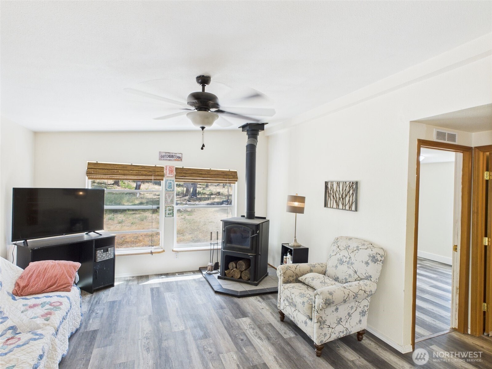 241 Wolf Fork Road Dayton, WA 99328 - Photo 33 of 40 a living room with furniture a flat screen tv and a fireplace