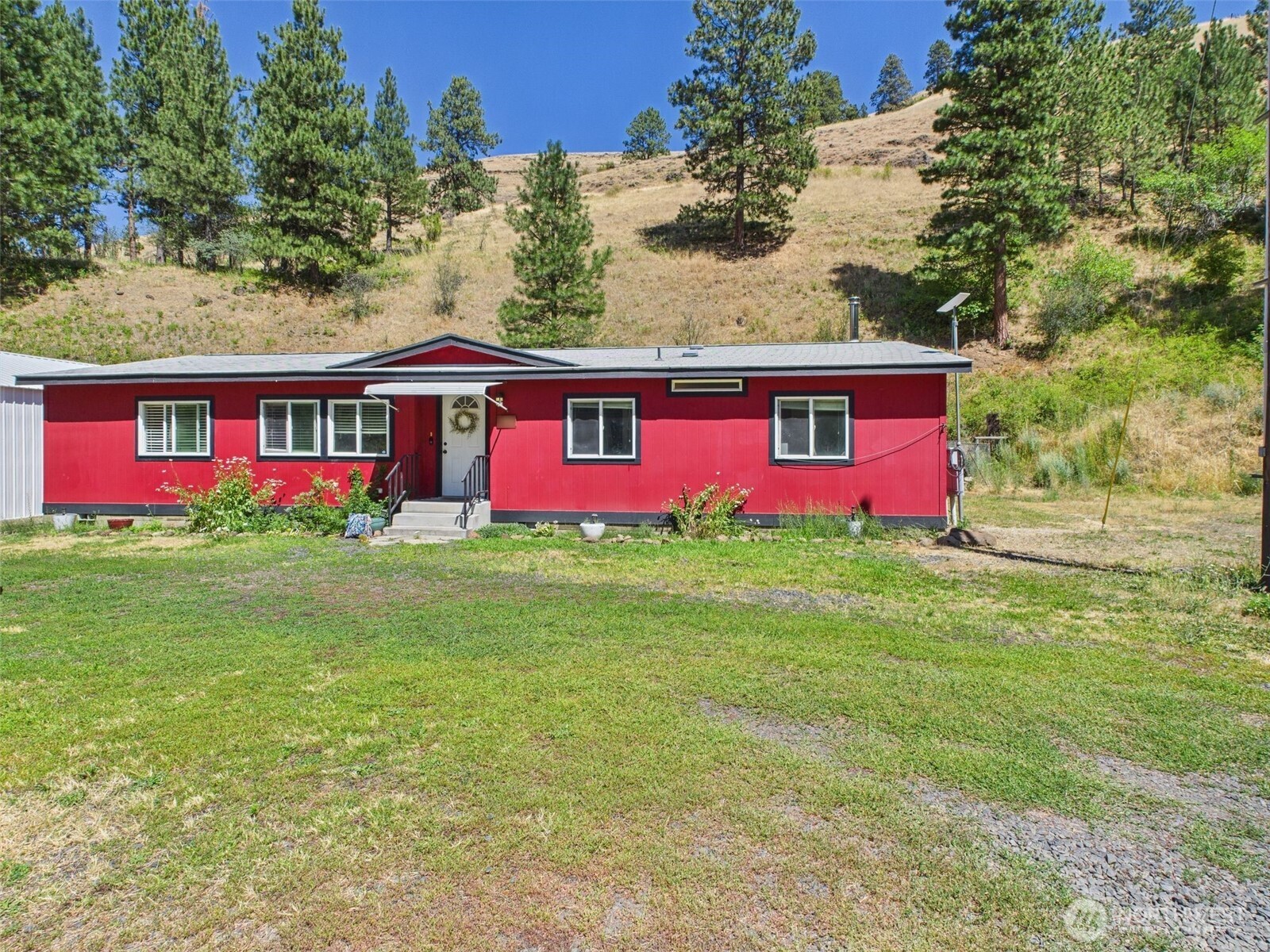 241 Wolf Fork Road Dayton, WA 99328 - Photo 39 of 40 a front view of house with yard and garage