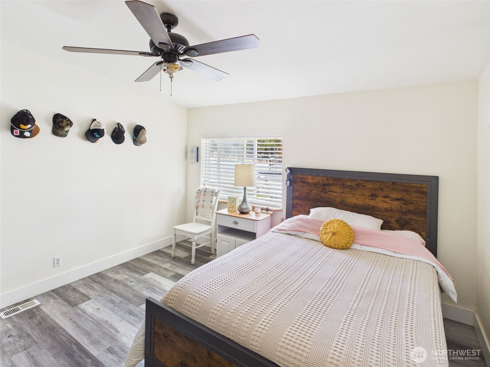 241 Wolf Fork Road Dayton, WA 99328 - Photo 5 of 40 a bedroom with a bed and a chandelier