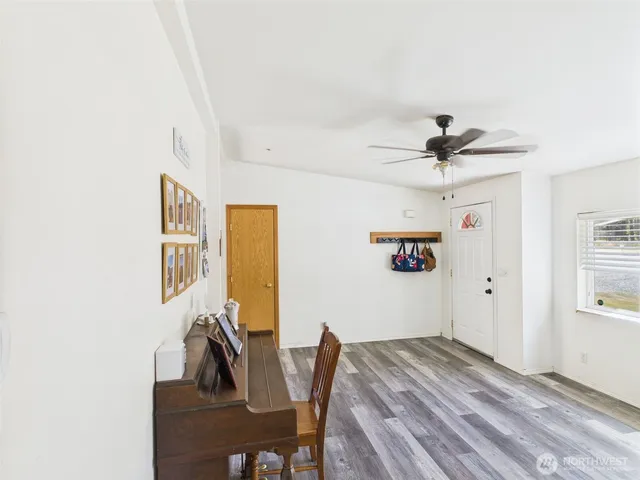 a view of a livingroom with furniture and wooden floor