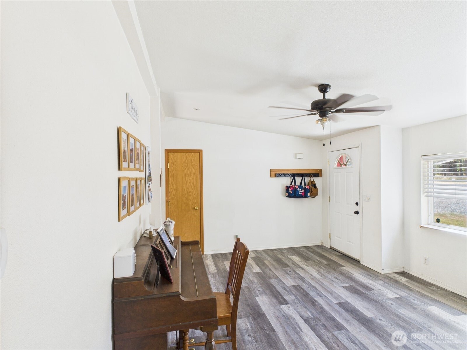 241 Wolf Fork Road Dayton, WA 99328 - Photo 8 of 40 a view of a livingroom with furniture and wooden floor
