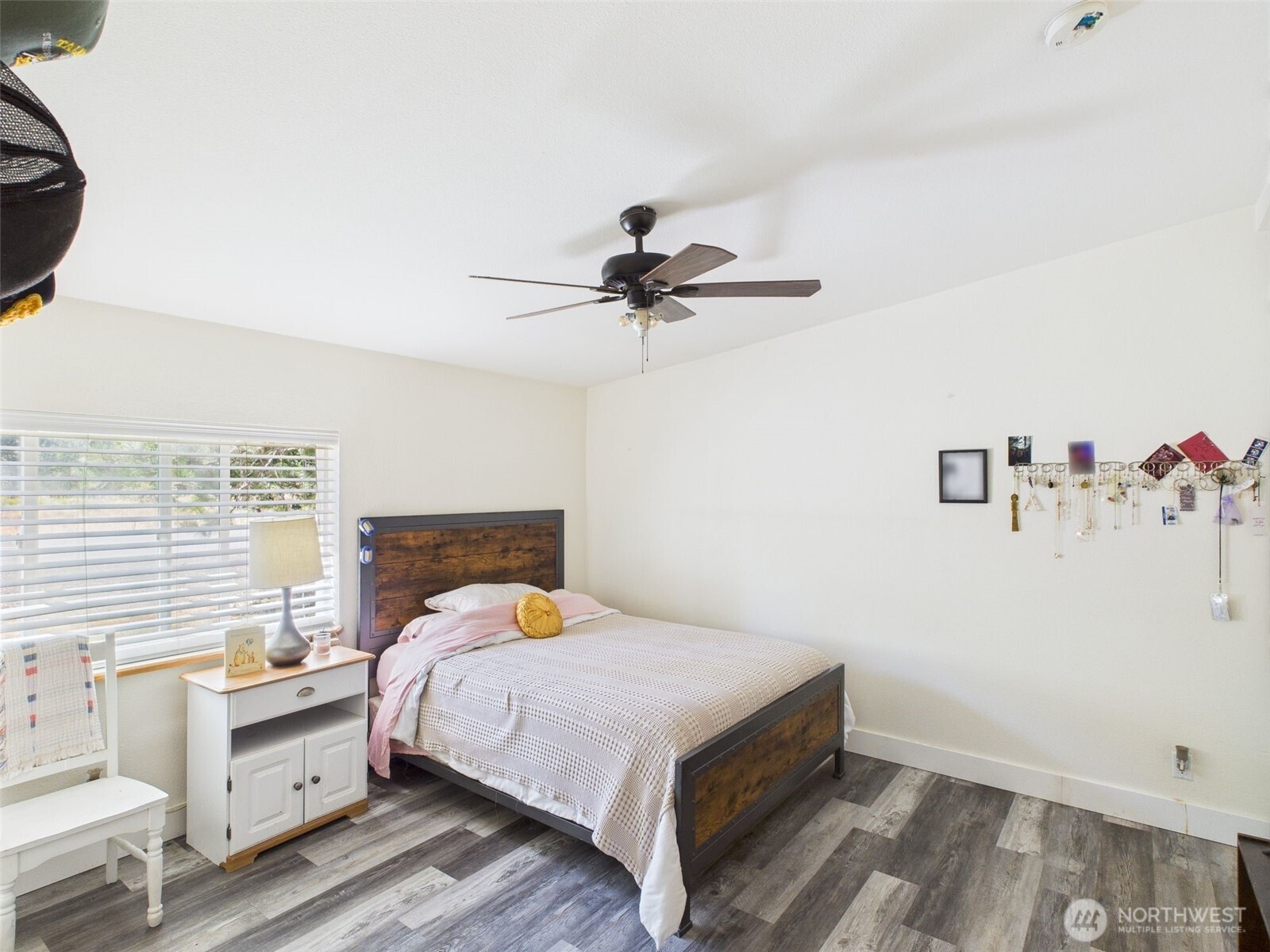 241 Wolf Fork Road Dayton, WA 99328 - Photo 9 of 40 a bedroom with a bed and a chandelier