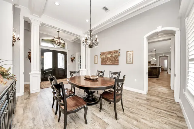 a large kitchen with kitchen island a stove a sink a center island and stainless steel appliances