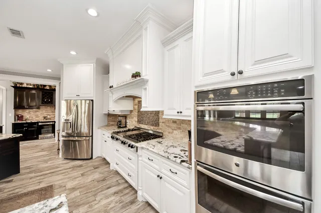a view of a kitchen from the hallway