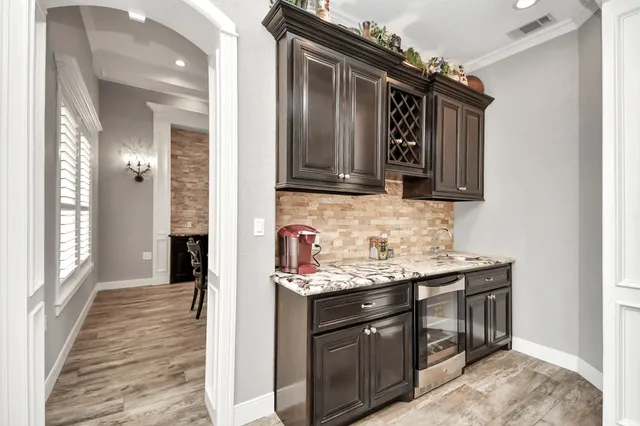 a kitchen with granite countertop stainless steel appliances and cabinets