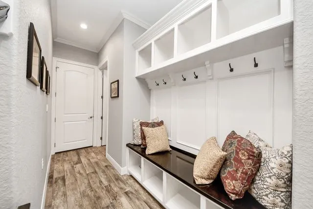 a view of entryway and hall with wooden floor