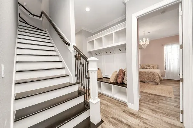 a bedroom with a bed a couch and dresser