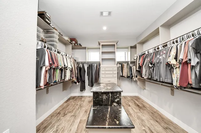 a bathroom with a bathtub and a window