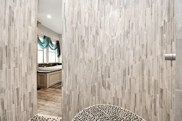 a view of a livingroom with furniture and hardwood floor