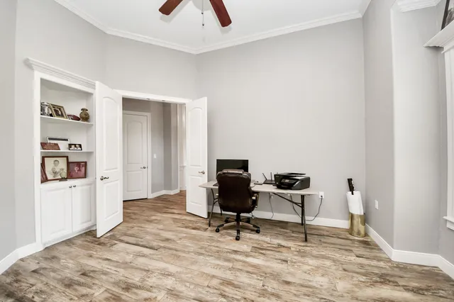 a bathroom with a granite countertop sink a toilet and a mirror