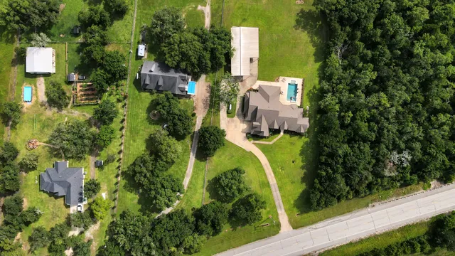 an aerial view of a house with a garden