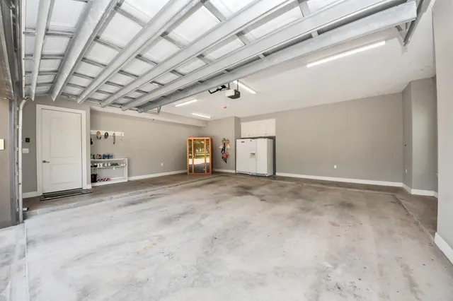 a view of a porch with couches and table under an umbrella