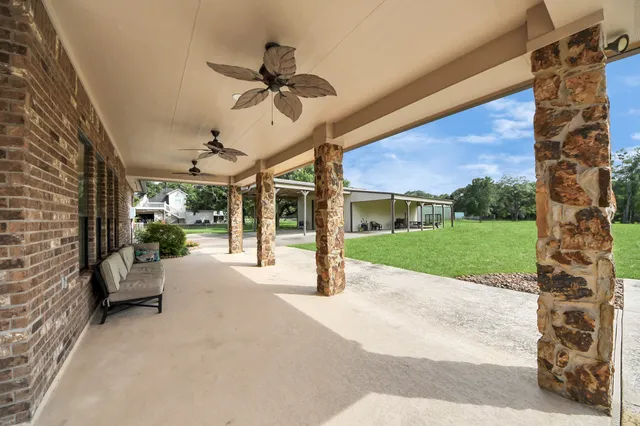 a view of a house with swimming pool and sitting area
