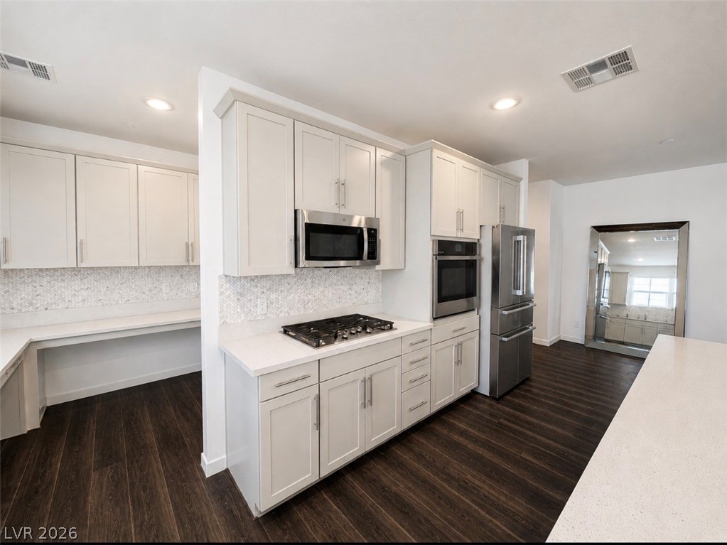 2555 Hampton Road, Unit 4205 Henderson, NV 89052 - Photo 14 of 52 This modern kitchen features sleek appliances and ample counter space for culinary pursuits.