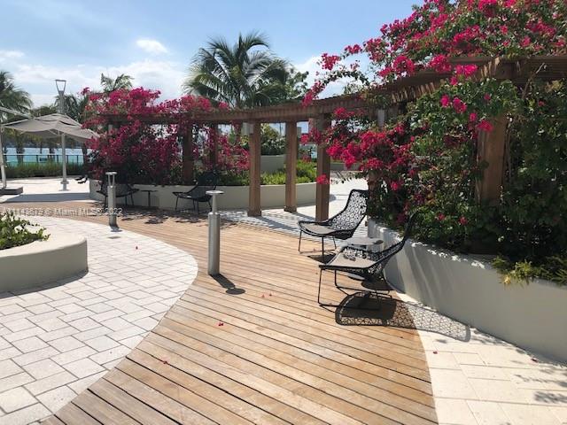 1500 Bay Road, Unit 958S Miami Beach, FL 33139 - Photo 15 of 20 a view of a terrace with sitting area