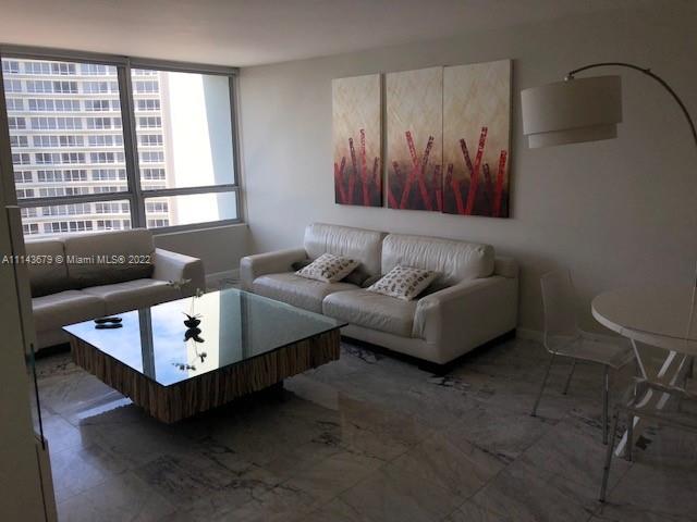 1500 Bay Road, Unit 958S Miami Beach, FL 33139 - Photo 7 of 20 a living room with furniture and a window