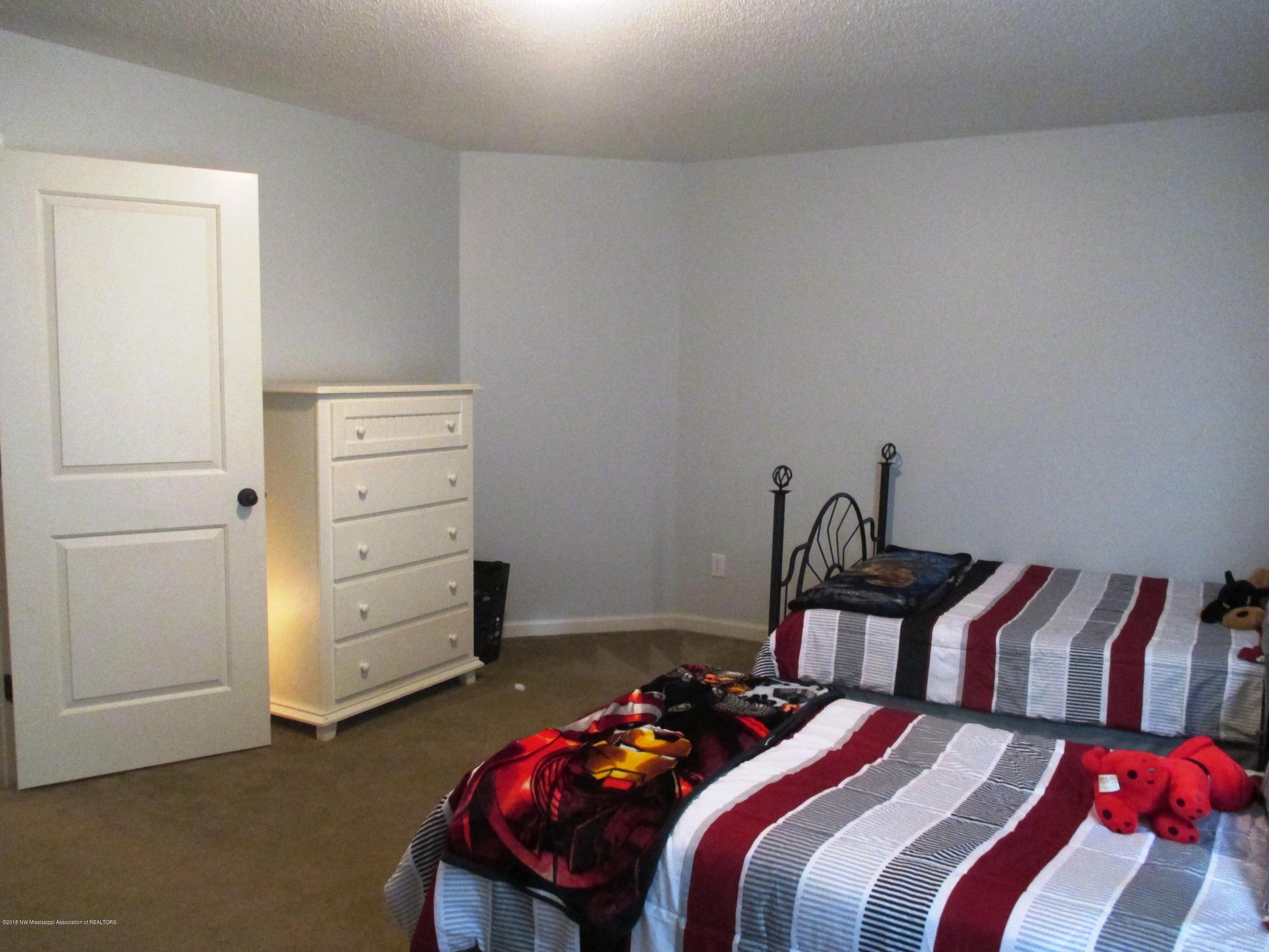 9239 Mitchell's Corner Road East Olive Branch, MS 38654 - Photo 23 of 31 Guest Bedroom